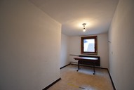 Verkauf Freistehendes Ein- bis Zweifamilienhaus mit viel Nebengelass Ansicht Hobbyzimmer