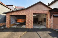 Verkauf Freistehendes Ein- bis Zweifamilienhaus mit viel Nebengelass Ansicht Garage 3 + 4